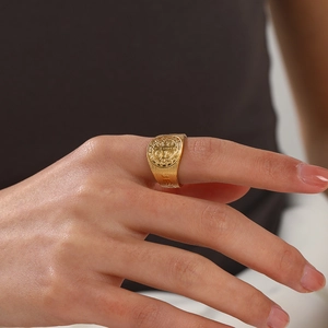 Vintage gold stainless steel cross signet ring with religious embossed medallion for women