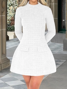 Detail of elegant white tweed long-sleeve dress with high neck and decorative pockets
