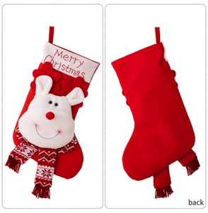 Detail of Christmas stocking featuring 3D plush reindeer and Merry Christmas embroidery