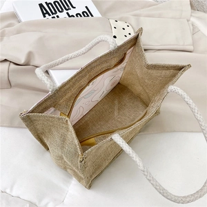 Minimalistische Jute-Tragetasche mit geflochtenem Seilgriff und Comic-Innenfutter