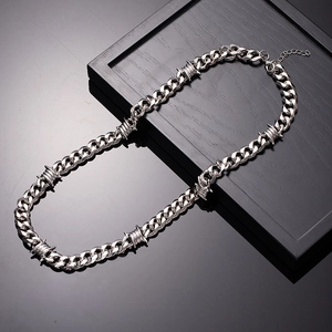 Silver punk Cuban chain necklace with thorn wire elements and adjustable lobster clasp