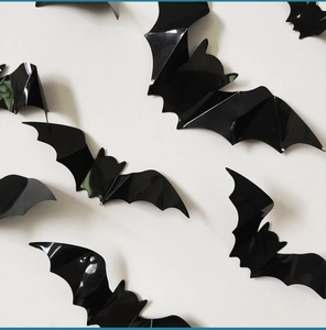 Detailed view of black 3D decorative bats with glossy finish for Halloween wall decor