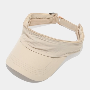 Detailed top view of beige sun visor with functional zipper design and textured fabric