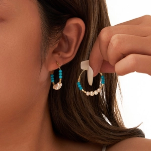 Gold turquoise and freshwater pearl S925 silver hoop earrings for women on model
