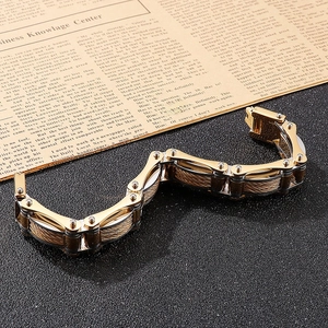 Macro detail of industrial two-tone chain bracelet with woven steel wire texture
