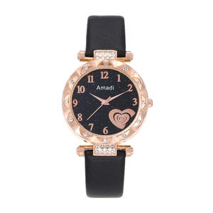 Women's rose gold starburst watch with crystal bezel and black leather strap