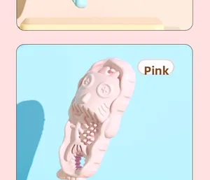 Detailed view of pink TPR slipper dog toy featuring textured fishbone pattern for chewing
