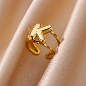Macro shot of 18k gold plated stainless steel ring featuring a 3D bubble letter K design