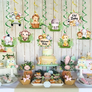 Detail of forest animal party swirl decorations above a dessert table with Oh Baby sign