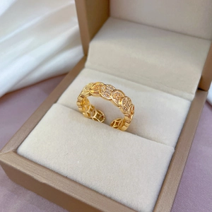 Luxurious gold-plated adjustable coin ring with crystals on a jewelry display box