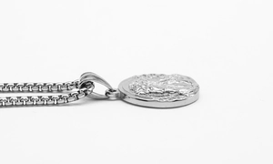 Detailed side view of silver Greek mythology portrait coin pendant and box chain
