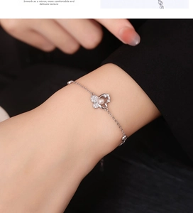 Detailed close-up of a 925 silver butterfly bracelet featuring pearls and zircon stones