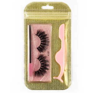 Detailed set of 3D thick false eyelashes with a pink applicator and brush in a gold pouch