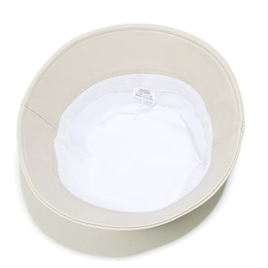 Detail view of beige PU bucket hat interior featuring white lining and adjustable drawstring