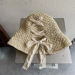 Beige straw sun hat with lace bow ribbon and crochet hollow design for women