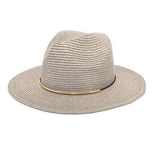 Close-up of lightweight woven straw fedora featuring a decorative gold metal band detail