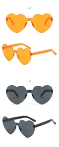 Front and side views of rimless heart sunglasses in vibrant orange and classic grey tones