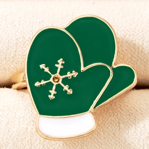 Macro detail of Christmas green enamel glove ring with snowflake pattern and yellow zircon