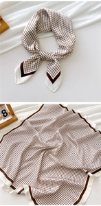 Detailed view of brown checkered square scarf with silk texture and smooth border finish