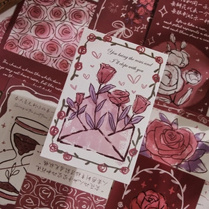 Close-up of vintage aesthetic scrapbooking stickers with rose theme and poetic script