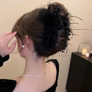 Elegant black feather hair claw clip with glass beads for vintage style updo hairstyle