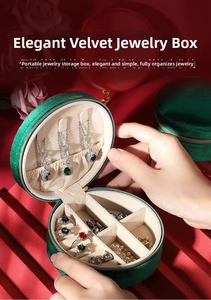 Detail view of round velvet jewelry box with necklace hooks and multi-grid ring slots
