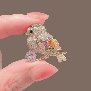 Exquisite gold bird brooch with colorful marquise stones and sparkling rhinestones