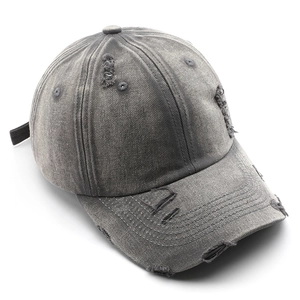 Retro washed distressed denim baseball cap in dark grey with vintage worn hole details