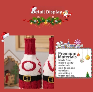 Close-up of knitted Christmas wine bottle cover with Santa suit and black belt design
