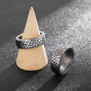 Set of two vintage men's titanium steel rings featuring a unique hammered texture finish