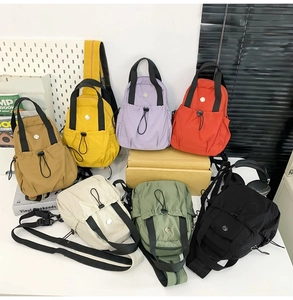 Collection of lightweight nylon sling bags in multiple colors for daily commute and sports