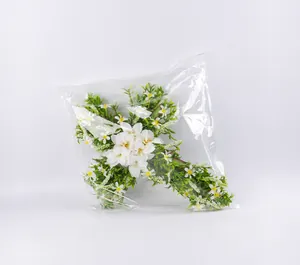 Detail view of the protective transparent packaging for the cross flower wreath decoration