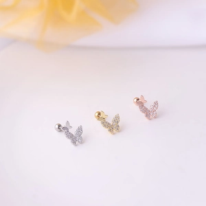 Three butterfly stud earrings in silver, gold, and rose gold with sparkling cubic zirconia