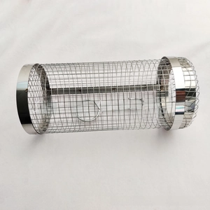 Close-up of cylindrical stainless steel BBQ grill basket with mesh texture and locking clips