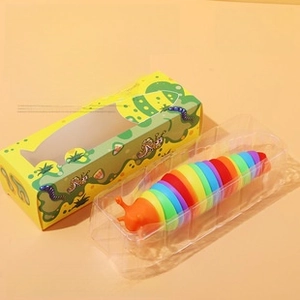 Rainbow slug toy featuring flexible segments and bright orange head in product packaging
