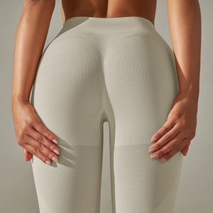 Close-up of seamless high-waist yoga pants featuring heart-shaped peach hip lifting texture
