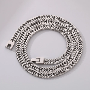 Macro shot of silver braided mesh stainless steel chain necklace with square jewelry clasp