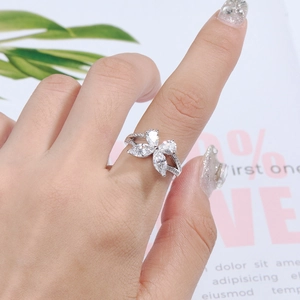 Detailed close-up of S925 silver ring featuring marquise-cut zircon clover on fingers