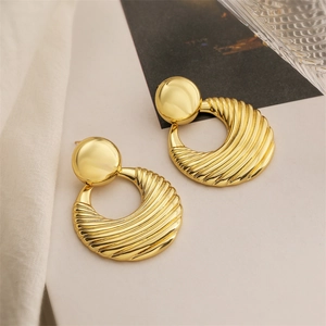 Vintage style 18K gold plated bow ear clips with textured round metallic design