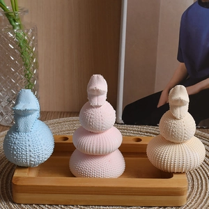 Detailed texture of multi-layered sea urchin ceramic ornaments in soft pastel colors