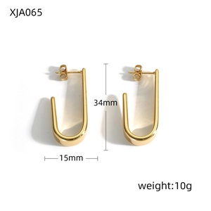 Detailed view of gold U-shaped earrings with measurements 34mm height and 15mm width