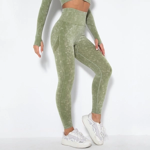 High-waisted seamless yoga pants for women with grey-green acid wash and ribbed details