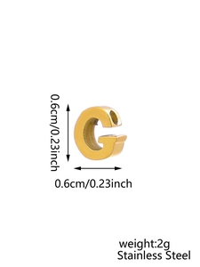 Macro detail of gold stainless steel letter G pendant with size and weight info