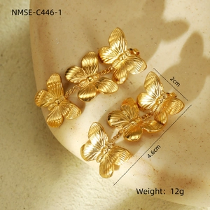 Detailed view of triple gold butterfly earrings with dimensions 4.6cm by 2cm and 12g weight