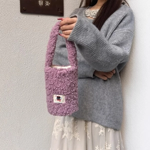 Plush purple faux fur carrying bag with cartoon patch for tumblers and water bottles