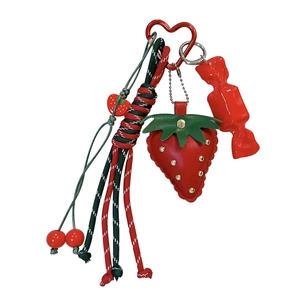 Vibrant red leather strawberry keychain with braided ropes tassels and candy charm