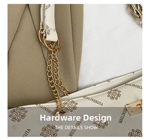 Detail shot of pale gold chain link and premium hardware on floral print tote bag