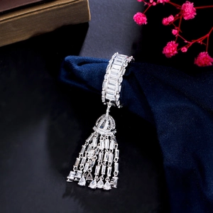 Luxury tassel ring in white gold finish with sparkling pavé cubic zirconia on blue silk