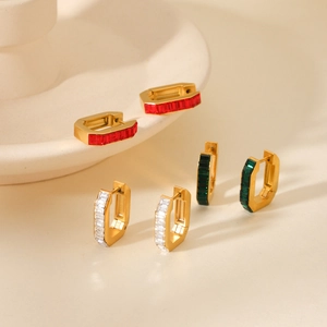 Detailed set of gold U-shaped earrings with red, green, and clear crystals