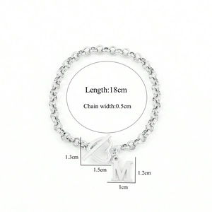 Silver chain bracelet with heart toggle clasp and M pendant featuring size dimensions